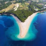 Croatia, Hvar island, Bol. Aerial view at the Zlatni Rat. Beach and sea from air. Famous place in Croatia. Summer seascape from drone. Travel - image